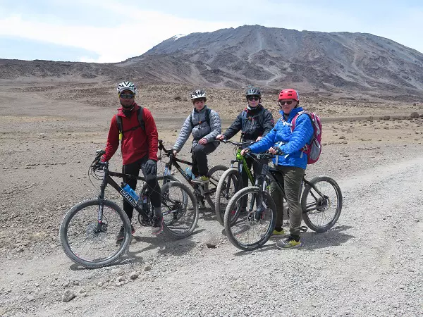 Bikers pausing during Kilimanjaro bike cycling tour around the mountain